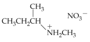 Chemical structure of an ammonium salt with a positively charged nitrogen and a nitrate anion.