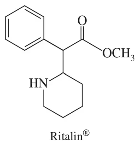 Chemical structure of Ritalin with highlighted chiral centers marked by asterisks.