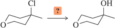 Chemical structure showing a chlorine atom converting to an alcohol, with a question mark indicating a missing reagent.