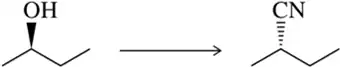 Chemical reaction: alcohol group (OH) converts to cyanide group (CN) on a carbon chain.