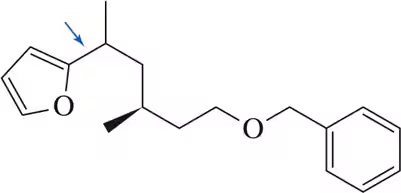 Chemical structure diagram showing bonds indicated by blue arrows, with organozinc halide and organohalide components.